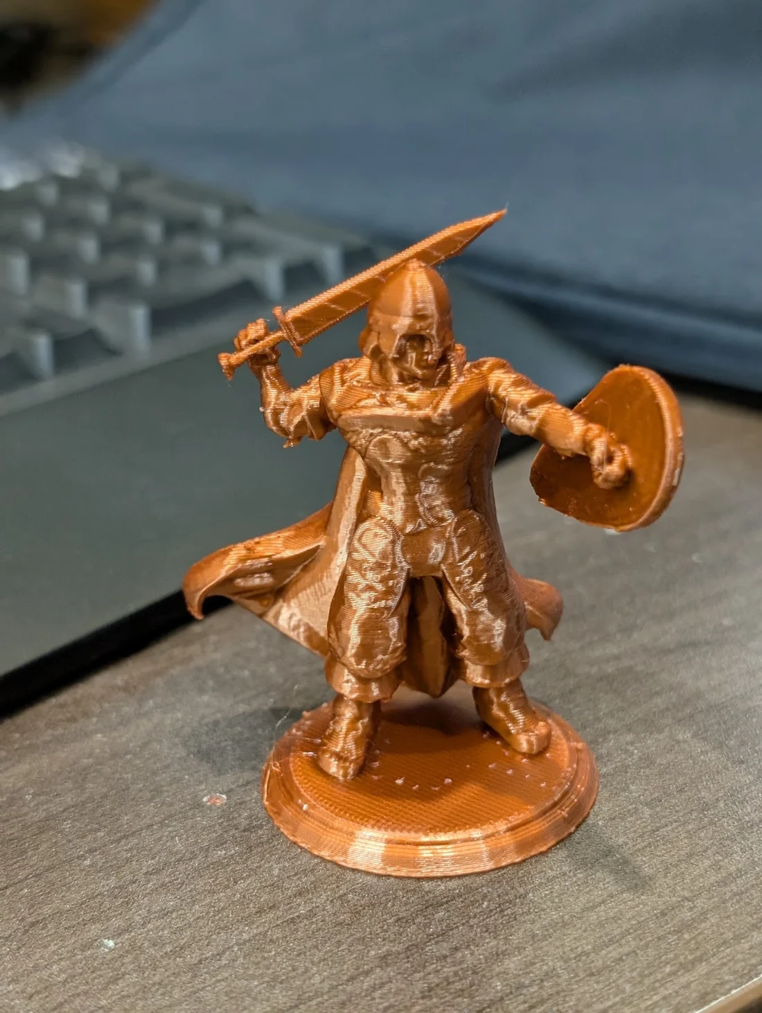 My bronze-coloured 3D print of an armoured warrior with a sword and shield